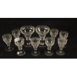 A set of eight Victorian cut wine glasses with vine leaf decoration and two matching champagnes