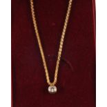 A two coloured Gold Diamond pendant rub over setting on 18ct Gold chain