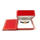 An 18ct Gold lady's Cartier 'Tank' quartz wristwatch with Sapphire set winder,