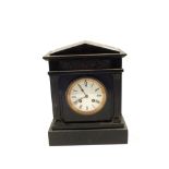 A black marble striking mantel clock