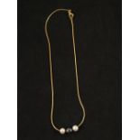 A Cultured Pearl and Haematite chocker style necklace consisting of a single Haematite (7.