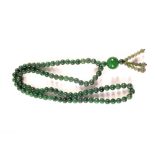 A Green Jade bead necklace with 90 (7mm) beads,