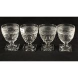 A set of four 19th Century cut glass rummers on square bases