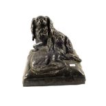 A large Bronze of two seated dogs, signed C.