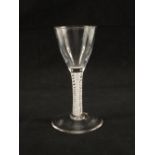 A Georgian wine glass with conical bowl on plain stem with opaque gauze centre surrounded by a