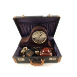 A case containing an Edwardian inlaid mantel clock,