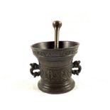 A heavy antique Bronze mortar with twin dolphin handles,