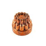 A Victorian circular Copper jelly mould with finger style surround by Benham & Froud and stamped