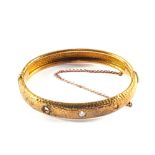 A yellow metal bracelet set with a Diamond (one Diamond missing)