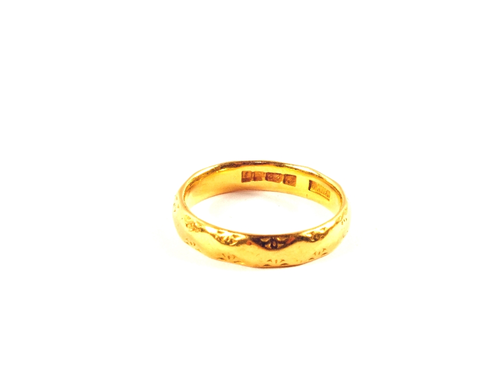 A 22ct Gold wedding band,