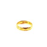 A 22ct Gold wedding band,