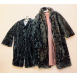 A lady's brown fur coat and black jacket