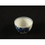 A small Royal Worcester blue and white tea bowl with floral and insect decoration