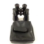 A pair of West German Optolyth Alpin 10x50 binoculars with eye piece protector and in case