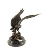 A Bronze Eagle on black marble socle,