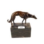 A bronze figure of a Greyhound on marble base