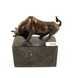 A bronze figure of a Bull on marble base