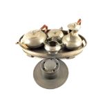 A 19th Century pewter inkwell and a pewter four piece tea set and tray