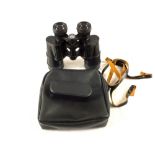 A pair of West German Optolyth Alpin 8x40 binoculars with eye piece protector and in case