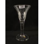 A Georgian heavy baluster wine glass with trumpet bowl,