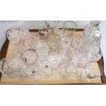 A pair of cut glass decanters and various wine glasses