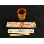 A 19th Century horn beaker scrimmed 'John Mills' sailing ship, a bone cribbage board N.C.