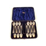 A cased set of twelve engraved Silver teaspoons and tongs,