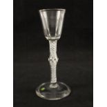 A Georgian wine glass with conical bowl on single knopped stem with central airtwist surrounded by