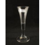 A Georgian wine glass with conical bowl, plain stem and folded foot,