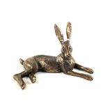 A bronzed figure of a recumbent Hare,