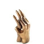 A pair of bronzed hands entwined,