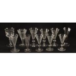 Six matching slice cut wine glasses and other 19th Century glasses