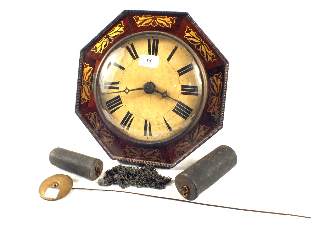 A 19th Century octagonal Rosewood wall clock with Brass inlays and bell