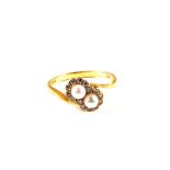 An 18ct Gold Diamond and Pearl cluster ring in the form of two interlocking flowers,