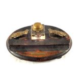 An Oak single bottle inkstand with hand shaped clips