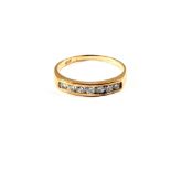 A 9ct Gold ring set with seven Diamonds,