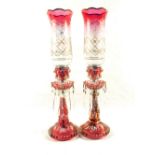 A pair of red flashed glass lustre candle lamps