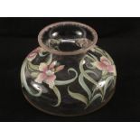 A squat glass vase with painted floral enamels,