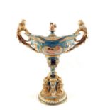 A 19th Century Serves lidded pedestal urn with cherub finial and caryatid handles with cherub and