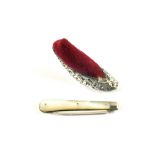 A Silver and Mother of Pearl fruit knife and a Silver shoe pin cushion