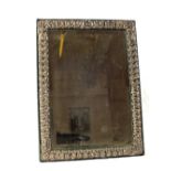 A rectangular embossed Silver easel mirror, marked Sterling,