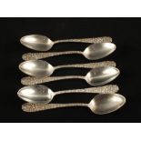A set of six Stieff Sterling teaspoons with floral decorated handles