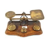 A set of Brass postal scales and weights