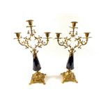 A pair of gilt metal and blue glass candelabra