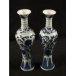 A matched pair of 18th Century Chinese blue and white Mei Ping vases with chrysanthemum decoration