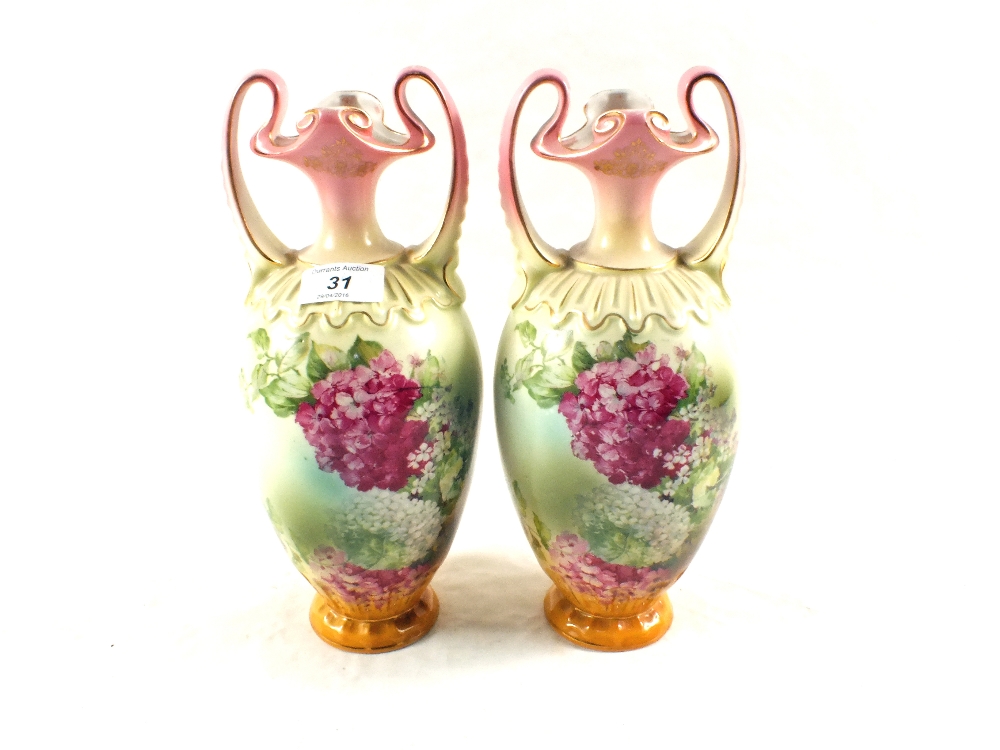 A pair of Edwardian porcelain floral vases