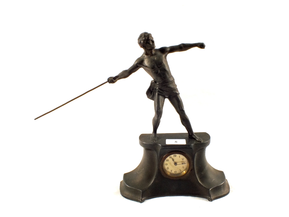 A spelter mantel clock with Greek warrior mount