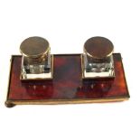 A Tortoiseshell and gilt metal two bottle inkstand