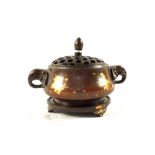 A Chinese Bronze gold splashed Koro and stand,