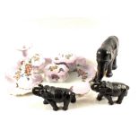 Three pottery elephants and a lilac porcelain dressing table set